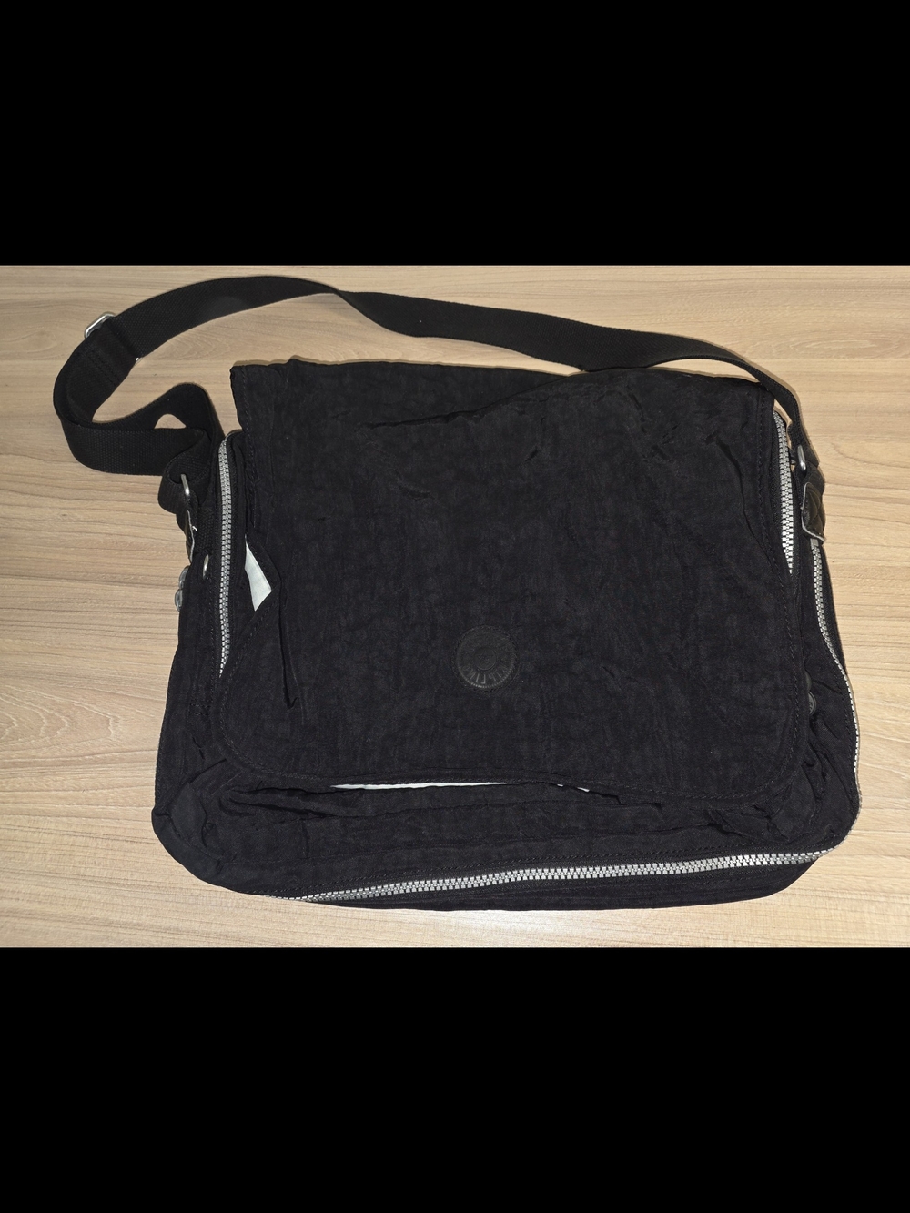 Kipling Black Messenger Bag with Front Flap and Zipper Details